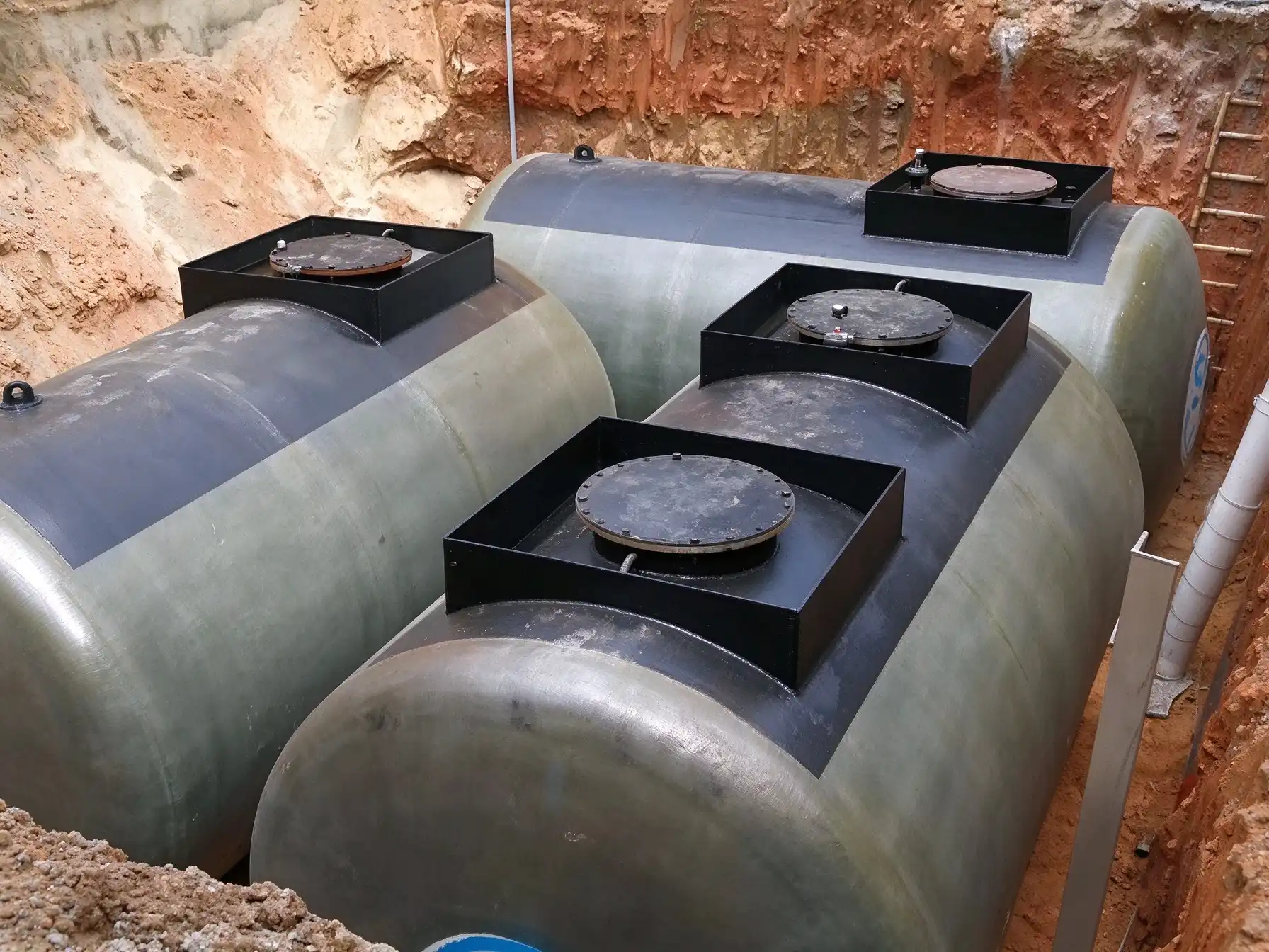 Underground Fuel Tank Installation Underground fuel tank installation at a gas station construction site